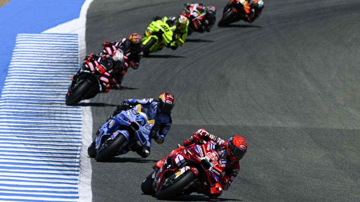 Marco Bezzecchi pushing hard on his bike as he holds second place near the finish at Jerez