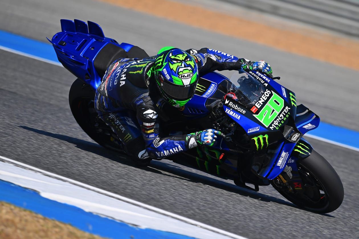 Aprilia ART CRT motorcycle on track during its MotoGP race debut with rider leaning through a corner