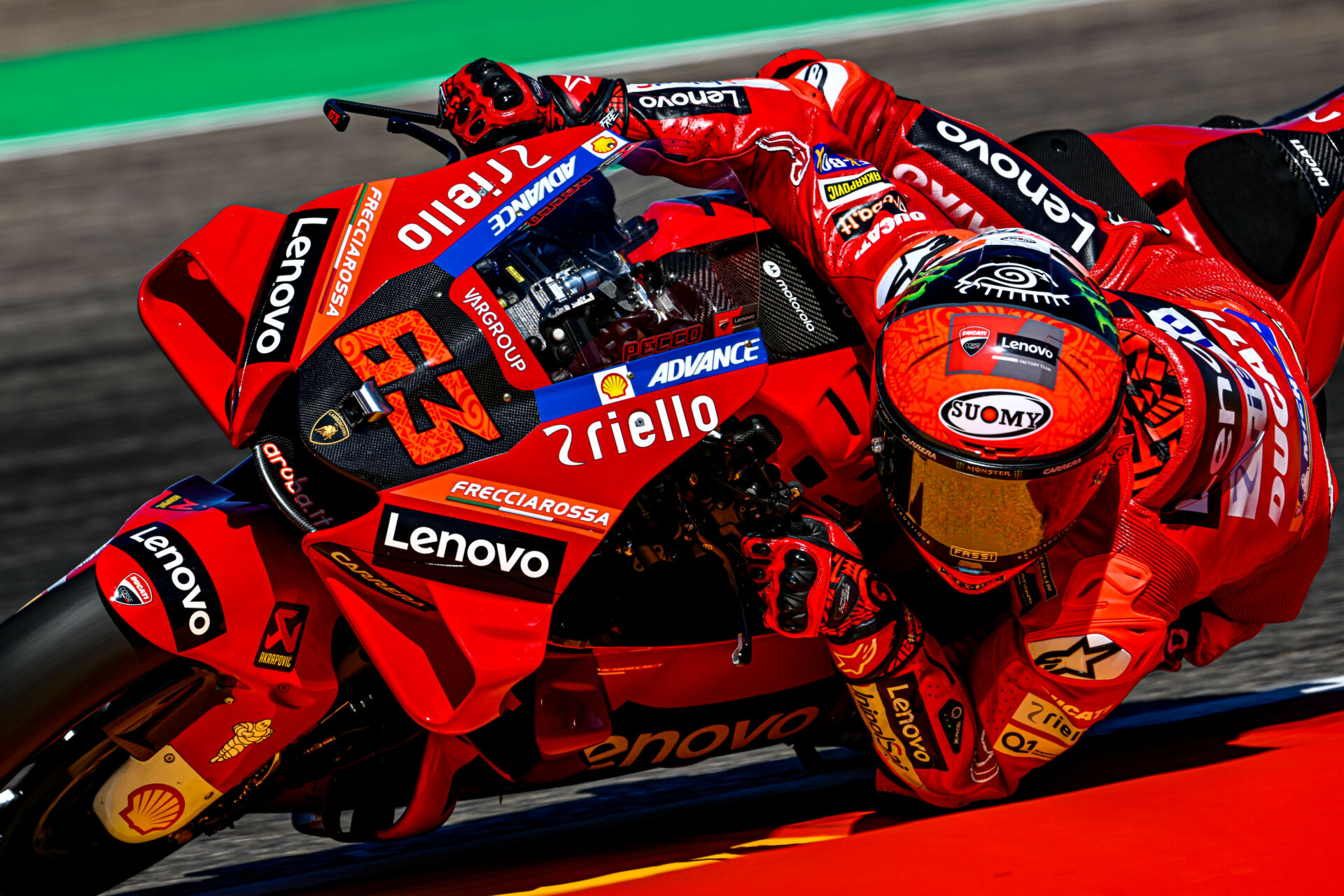 Pecco Bagnaia riding his Ducati in his early MotoGP season, leaning into a corner during a race weekend