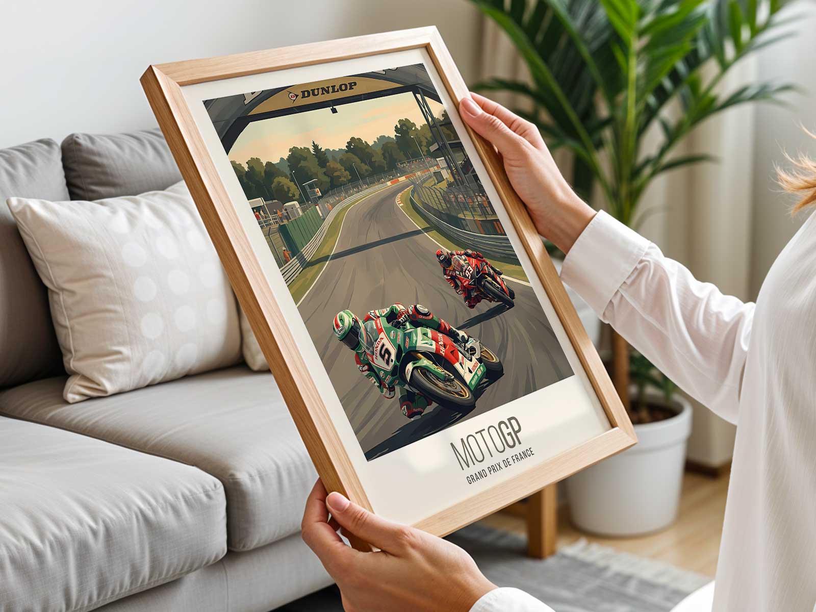 Wide shot of Le Mans circuit with Ducati MotoGP bike approaching braking zone