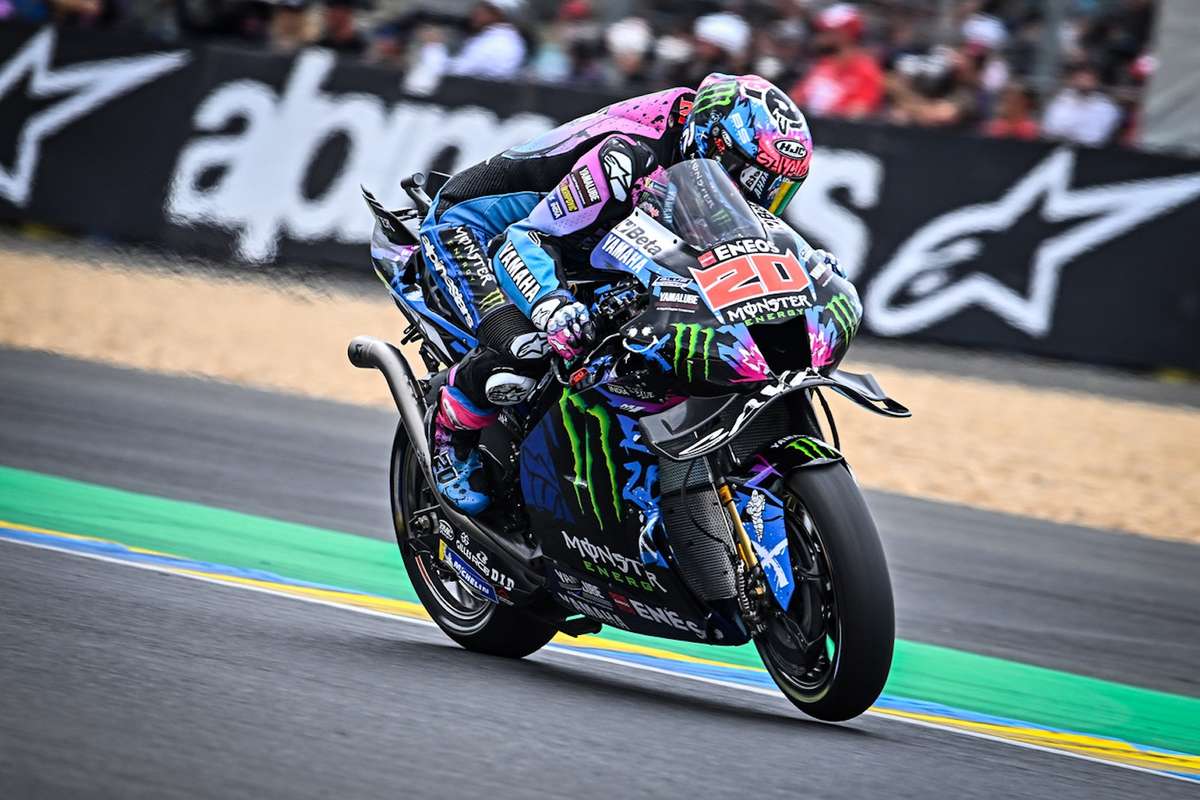 Quartararo braking hard into a corner on the Honda, hands visible on the brake and subtle weight transfer forward