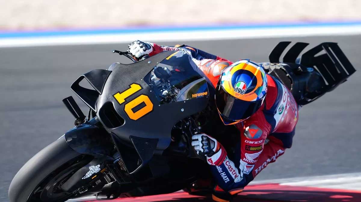 Front three-quarter view of Honda RC213V showing front tire contact patch and fork angle during corner entry