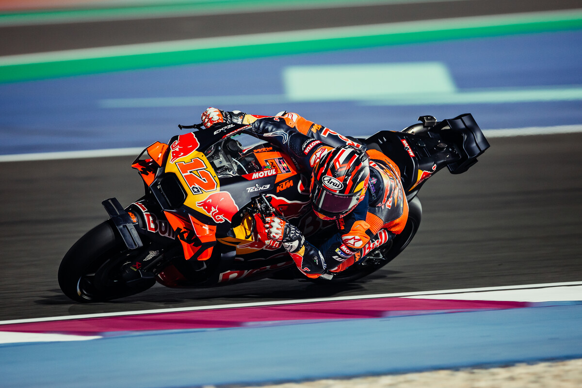 Red Bull KTM factory garage with RC16 bikes being prepared by mechanics ahead of a MotoGP session