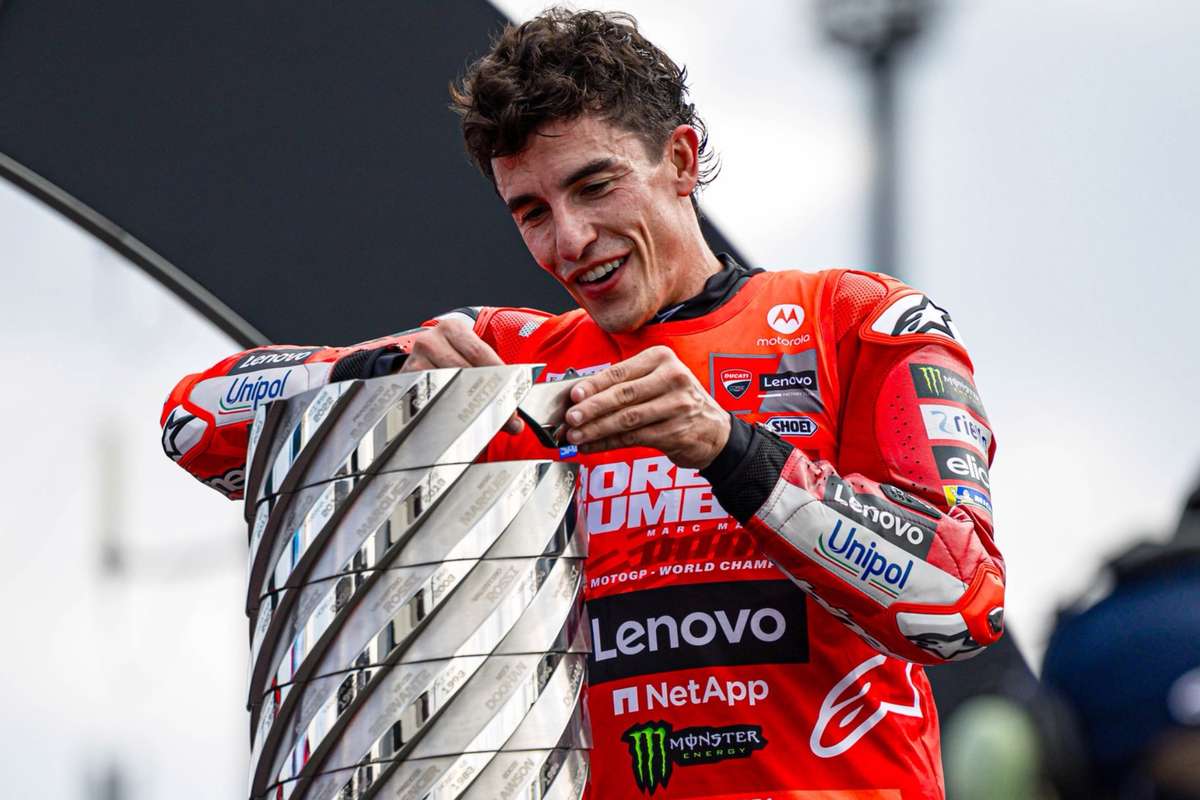 Marc Márquez riding the Ducati on a racetrack during a timed session, leaning into a fast corner
