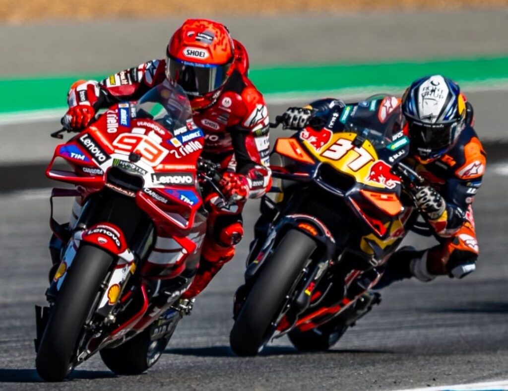 Marc Marquez with Alpinestars leather suit and knee slider touching the asphalt during a hard lean