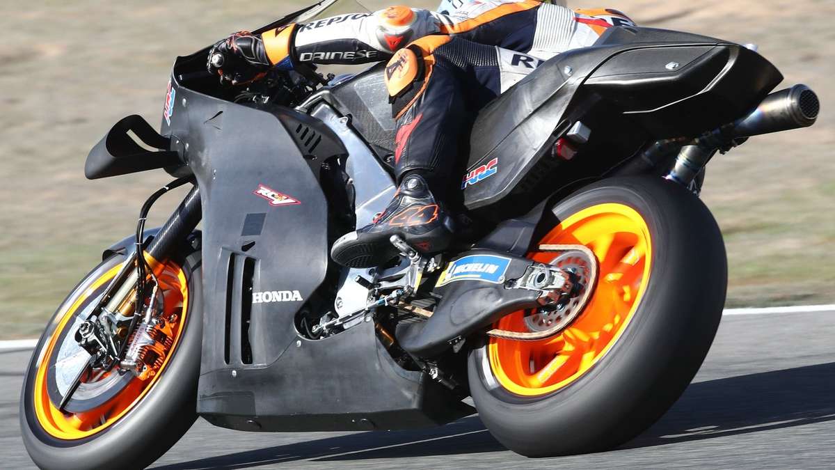 Detailed close-up of the RC213V V4 engine with exposed cylinder layout and components