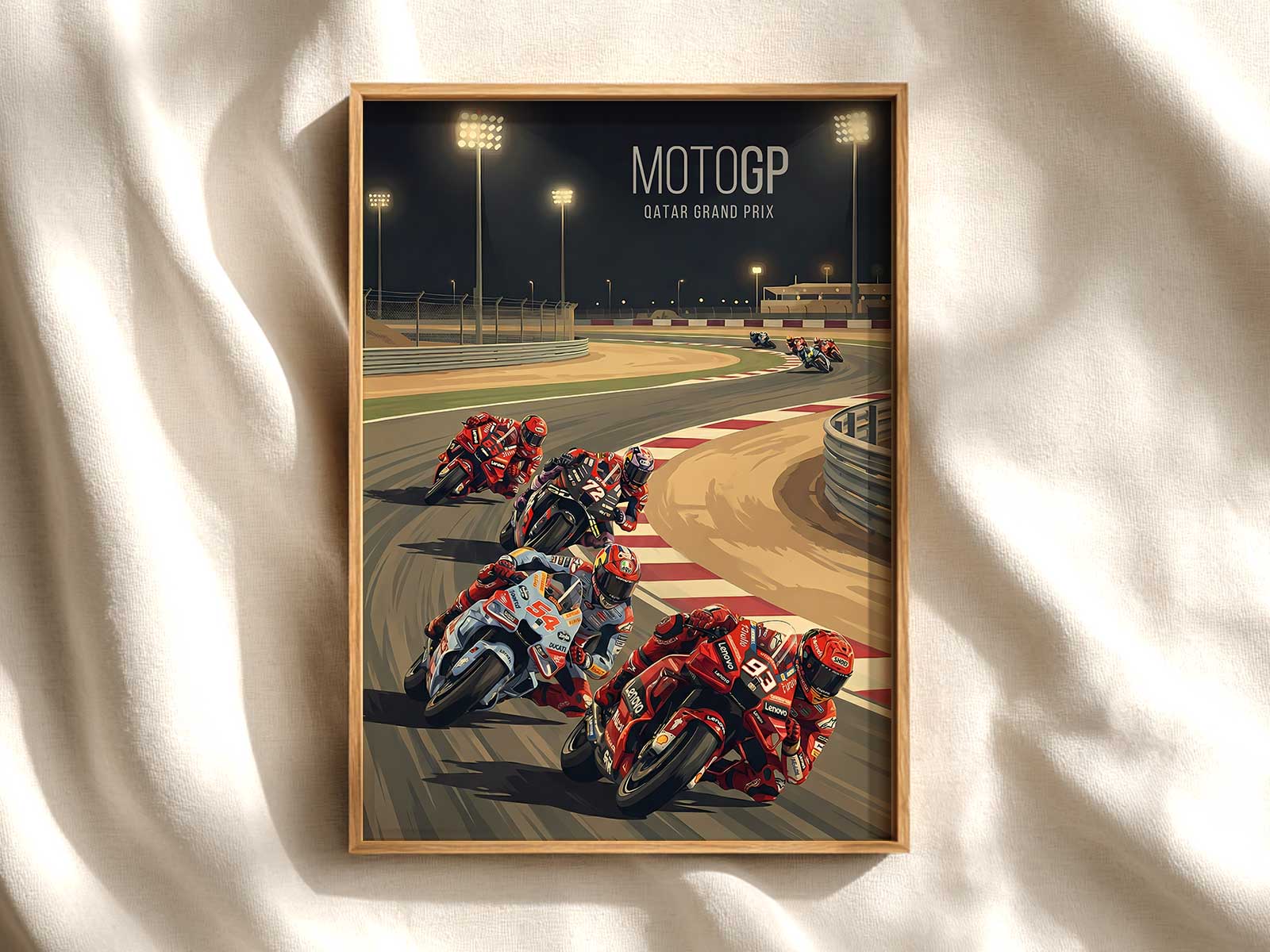 Gallery-style wall of framed MotoGP Qatar posters and related race art creating a cohesive collector display