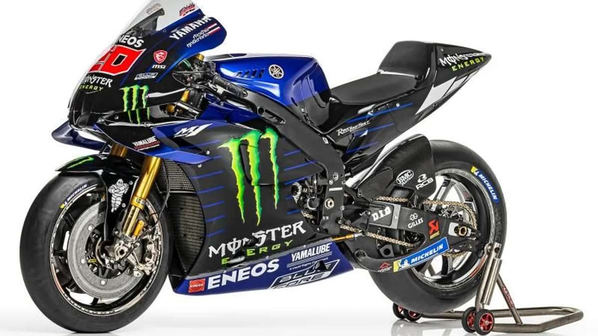 Close-up of a 1990s Yamaha MotoGP-era prototype chassis and frame components in the workshop